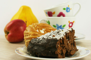 homemade chocolate cake and cup on a wooden table