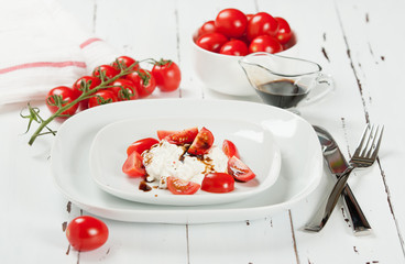 Cherry Tomatoes, Soft Cottage Cheese. White Table.