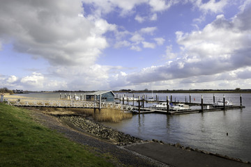 Fototapeta na wymiar Small port on the river Lek in the Netherlands