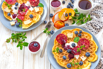 Coffee and Belgium waffles with blueberry. Breakfast concept.