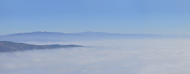 Panorama of fog and cloud mountain valley landscape. misty forest in the morning