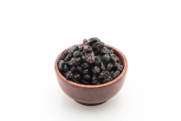 Fototapeta na wymiar black raisins on white