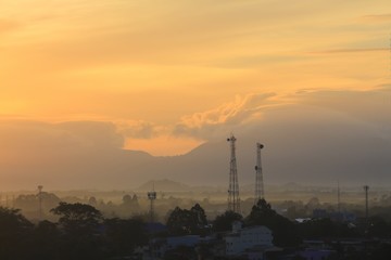 Fototapeta premium sunrise sky in the morning and silhouette building in city colorful nature. with copy space for add text