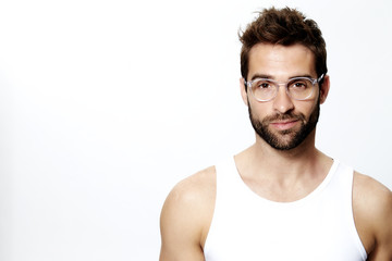 Portrait of man smiling in white vest