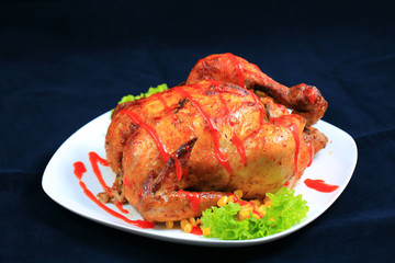 Baked chicken on white plate.