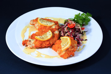 Baked chicken on white plate.