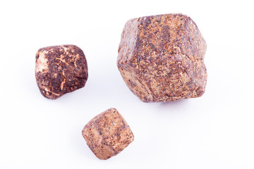 Macro stone mineral Garnet against white background