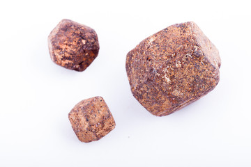 Macro stone mineral Garnet against white background