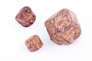 Macro stone mineral Garnet against white background