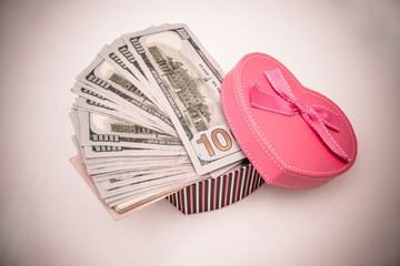 gift box as heart with US currency 