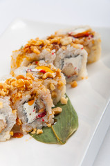 sushi roll with tuna, Philadelphia cheese, flying fish caviar, peanuts