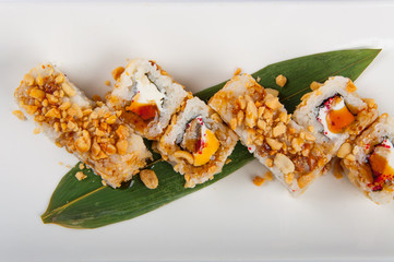 sushi roll with tuna, Philadelphia cheese, flying fish caviar, peanuts