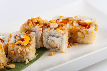 sushi roll with tuna, Philadelphia cheese, flying fish caviar, peanuts