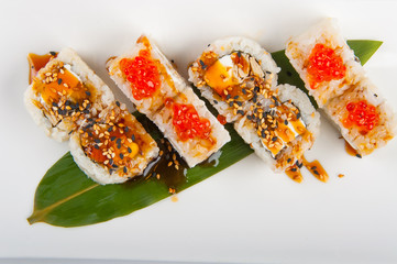 sushi roll with tuna, scrambled eggs, cream cheese and red caviar