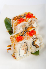 sushi roll with tuna, scrambled eggs, cream cheese and red caviar