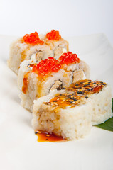 sushi roll with tuna, scrambled eggs, cream cheese and red caviar