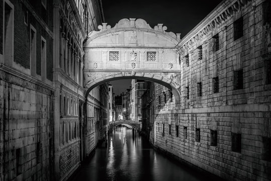 Famous Bridge of Sighs (Ponte dei Sospiri) landmark at night, Venice (Venezia), Italy, Europe, Black and white