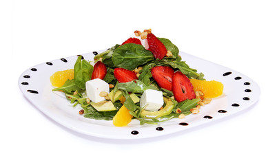 salad with feta cheese and vegetables, arugula, strawberries