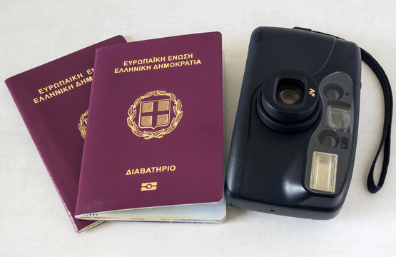 Two passports and a camera. Concept - preparation for travel.
