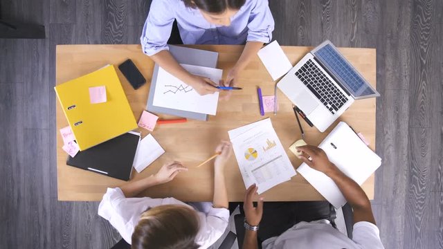 Business partners sitting at table and planning work