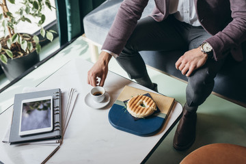 Businessman having breakfast at coffee shop