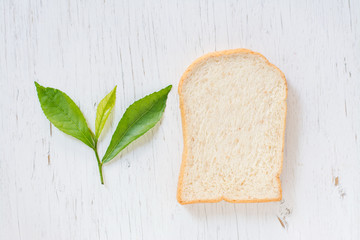 Cut fresh bread on the wood table,Sliced bread to toast on wood background. Close up. Top view
