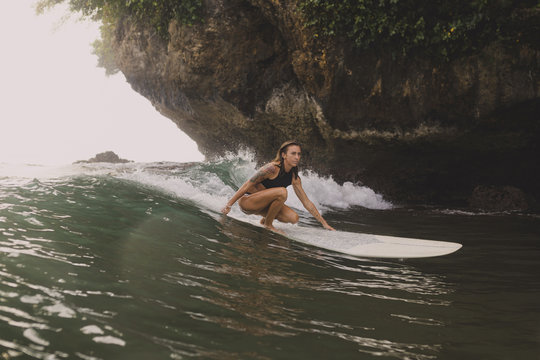 Indonesia, Java, woman surfing