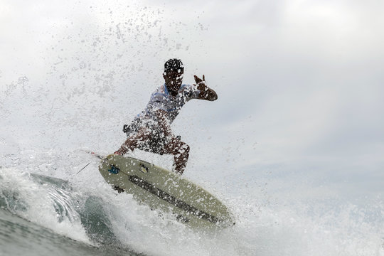 Indonesia, Java, man surfing