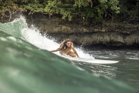 Indonesia, Java, woman surfing