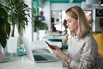 Serious woman addicted to technology