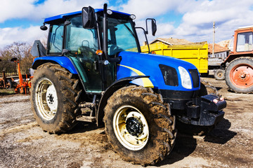 Closeup of tractor after plowing.  Wheels covered with mud. Agronomy, agriculture,concept.