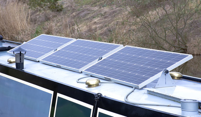 Solar panels intaled on boat roof.