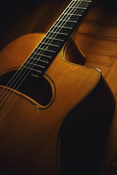 Closeup view of gypsy guitar body and neck.