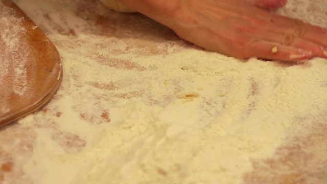 Woman working with dough. making homemade croissants