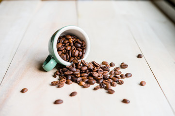 Coffee. Coffee beans. Coffee cup full of coffee beans. Toned image.