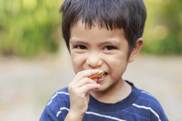 Boy eating fish crisp