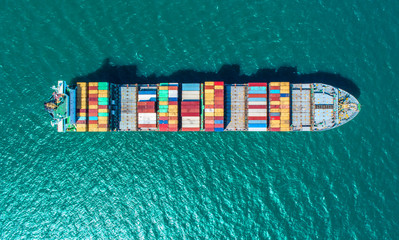Fototapeta na wymiar container ship in import export and business logistic.By crane ,Trade Port , Shipping.cargo to harbor.Aerial view.Top view.