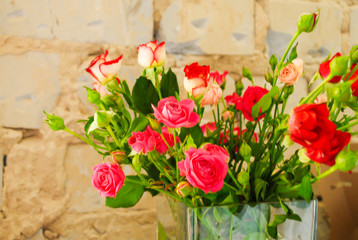 A bouquet of roses in a glass vase