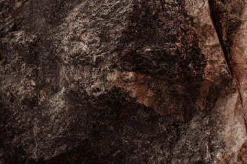 texture of a stone a close up of brown color with dark streaks