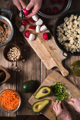 Preparation Salad from radish, chickpea, avocado and carrot