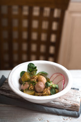 Salad with potatoes, cucumber and radish ceramic bowls side view