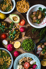 Feast with vegetable salads and sandwiches