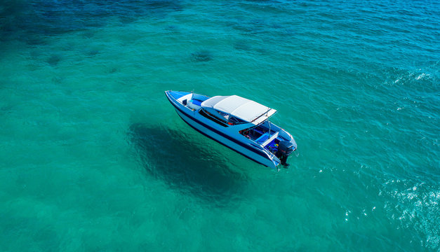 Speed boat in the sea.Aerial view. Top view.amazing nature background.The color of the water and beautifully bright.