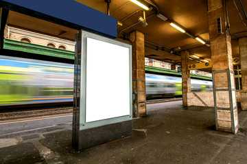 Blank outdoor advertising board at train station.