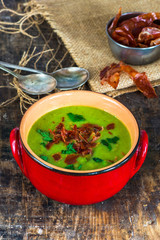 Pea and mint soup with crispy proscuitto strips