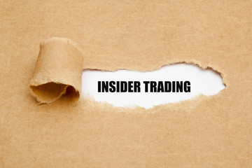 Insider Trading Torn Paper Concept