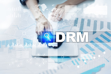 Woman working with documents, tablet pc and selecting drm.