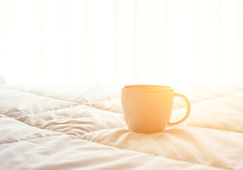 Fresh morning coffee on the bed.