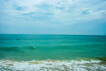 Fototapeta na wymiar The sand beach with sea wave water