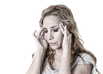 depressed woman looking desperate in pain face expression suffering migraine and headache